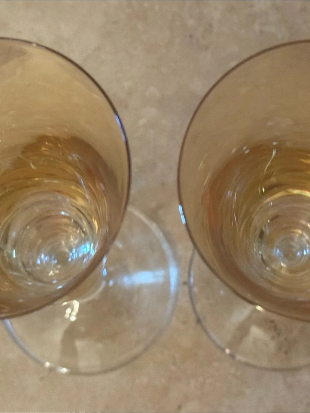Pair of Vintage Iridescent Amber Fluted Champagne Glasses with Clear Stem.